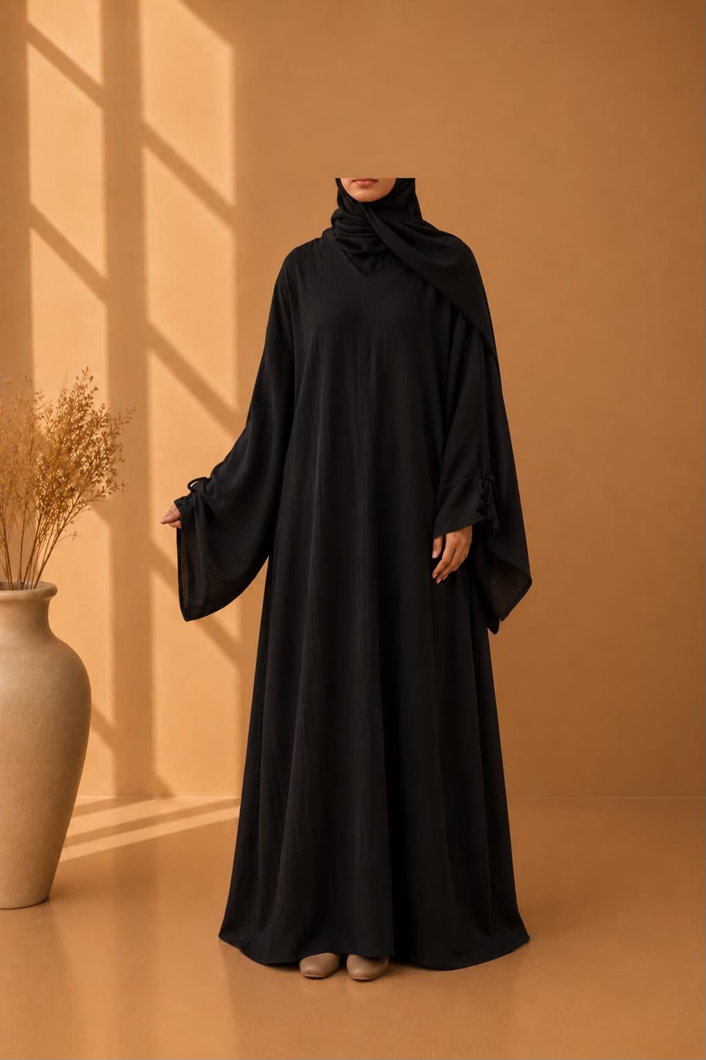 Abaya Hidaya en noir avec hijab intégré